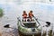 Children in life jackets swimming on boat