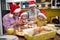 Children like helping grandma and grandpa preparing Xmas meal in the kitchen. Christmas, family, together