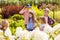 Children listen the teacher at the flower garden