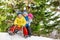 Children little boys and girl slide on sledge