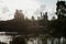 Children look at the ducks from a pier dock in a park