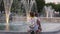 Children look at fountains in a city park