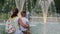 Children look at fountains in a city park