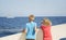 Children look at the sea from the boat\'s deck