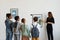 Children Looking at Paintings in Gallery Back View