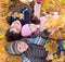 Children lying in fall leaves