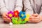 Children made from the details of colored sticky mosaic flowers on the table. Leisure of the child in confinement.