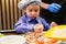 Children make pizza. Master class for children on cooking Italian pizza.