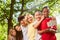 Children make selfie with smartphone in the park