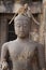 Children Monkey standing playing on ancient Buddha head statue, Candid animal wildlife picture waiting for food, group of mammal