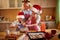 Children and mother enjoying in preparing Christmas cookies