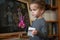 Children multicolored chalk drawing on blackboard