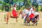 Children in national Russian attires are riding a pony on a pony at the equestrian sports festival