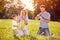 Children in nature having fun with soap bubbles