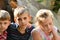 Children are near the ruined house, the concept of natural disaster, fire, and devastation.