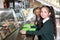 Children near serving line with healthy food in canteen