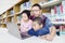 Children observing their dad teaching in library