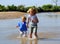 Children paddling in river