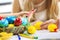 Children paint Easter eggs at home