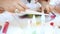 Children painting with colored sand