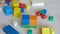 Children and parent playing together with wooden bricks