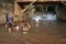 Children and parents play in the water at the bottom of the weir at Faikeng in Pua District.