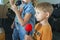 Children participate with a microphone, recite poems, recitation