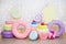 Children party background - set of huge artificial sweets and pastry decorations over white brick wall