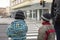 Children at pedestrian crossing with red light