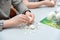 Children peel boiled eggs from their shells for making salads