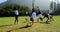 Children performing cart wheel during race