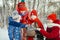 children petting a rabbit and laughing in winter on a cold day