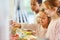 Children pick up food at the cafeteria`s buffet