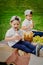 Children at a picnic on a green meadow.