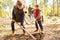 Children plant trees together on a forest tour