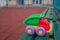 Children plastic toy truck in park on a bench