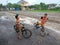 Children play bicycles