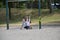 Children play on a closed Toronto public playground during the Covid-19 Pandemic.