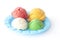 Children play colorful dough mold is a colorful ice cream in blue plastic plate on white background.