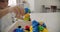 Children play with educational toy colorful blocks at day care or preschool. toys. Close up