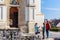 Children at play in front of the Gothic Franciscan Parish Church in Kezsthely, Hungary