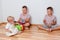 Children play at home. three children sit on the floor