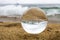 Children Play in Large Surf at Beach in Glass Ball