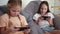 Children play with a mobile phone at home