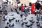 Children play among the pigeons next to Yeni Camii (New Mosque), Eminonu, Istanbul, Turkey.