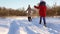 Children play and run with dog on white snowdrifts. Slow Motion.