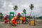 Children playground with attractions and palm trees at the tropical island