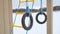 Children playground gymnastic rings swing, snow winter landscape a