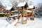 Children Playground In Public Park Covered With Winter Snow