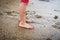 Children playing barefoot sandy beach of Atlantic ocean in Spain